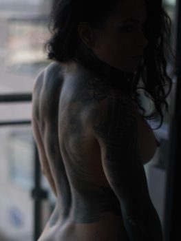 Athletic, built back and shoulders of fit and attractive woman