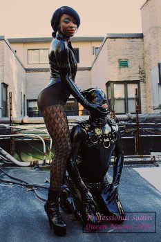 Queen Naomi NYC with her rubber gimp under her command